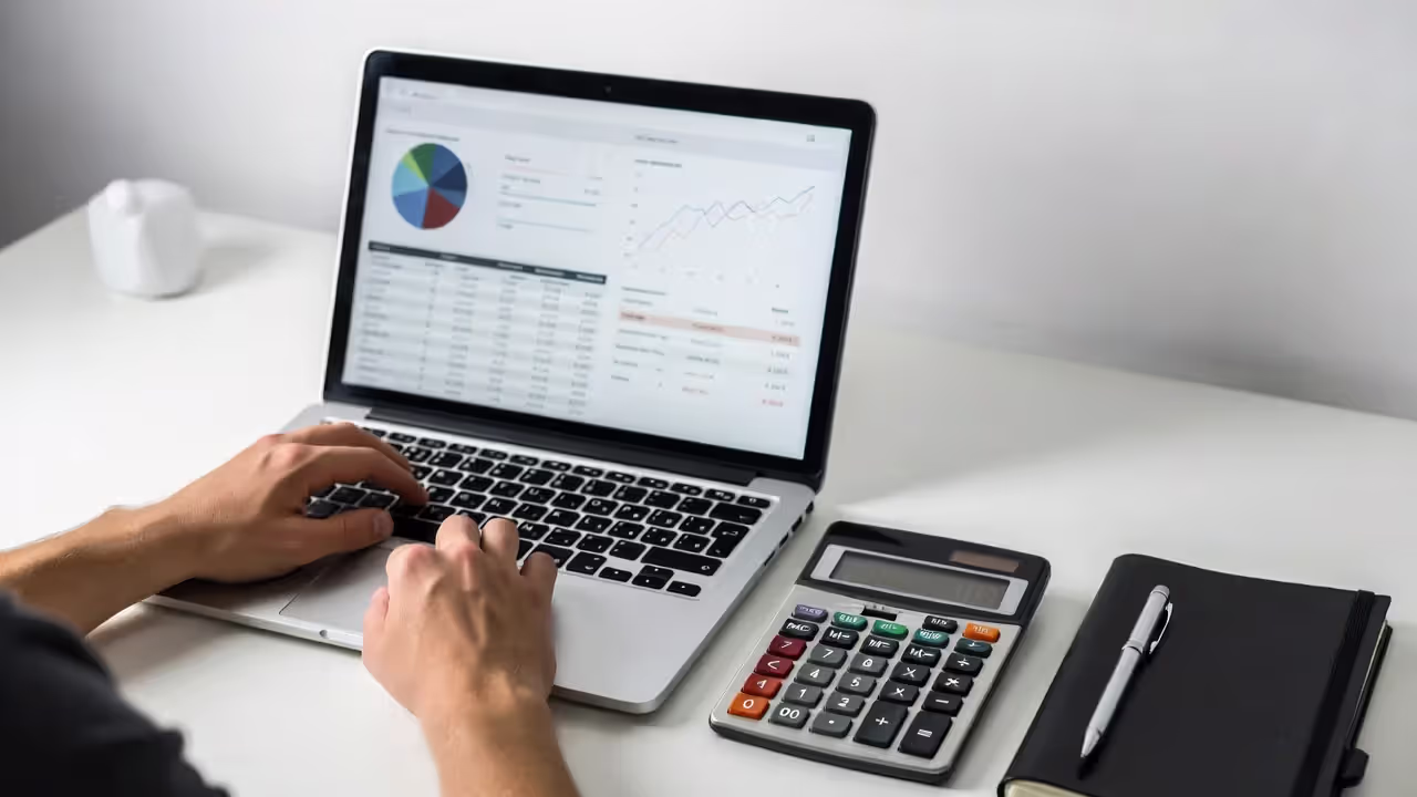 person comparing insurance costs and deductibles on laptop