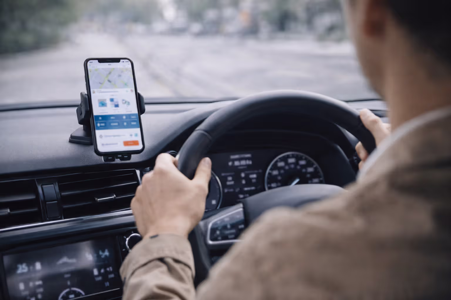 driver using telematics app while driving